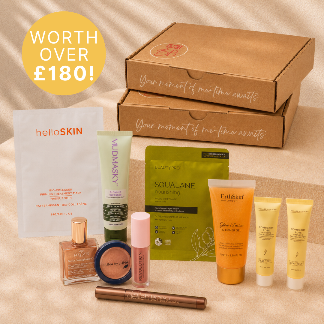 Cosmetic gift set with various skincare products and packaging on a beige background